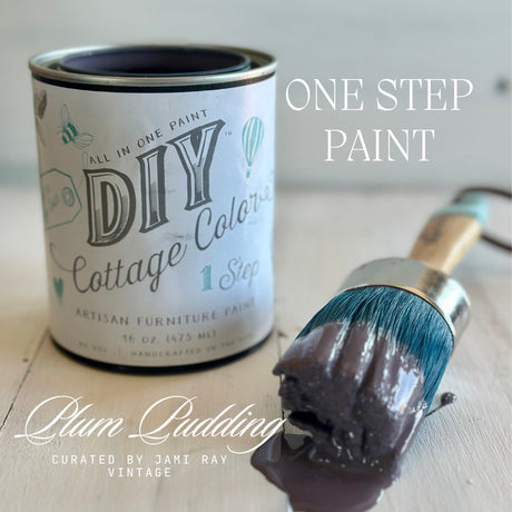 DIY Paint Co. Plum Pudding DIY Cottage Color can beside a brush with purple water-based paint.