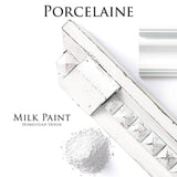 White trim, powder pile, and reflective surface labeled Porcelain Milk Paint by Homestead House.