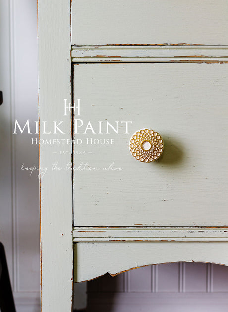 PotPourri Milk Paint by Homestead House on a drawer with gold knob; product name overlaid on white wall.