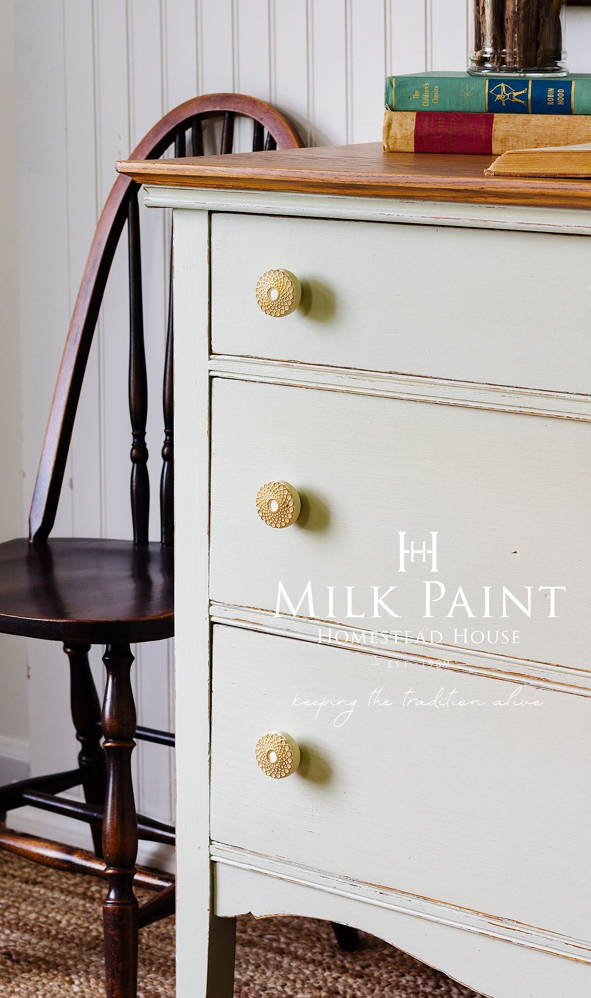 PotPourri Milk Paint by Homestead House on dresser with gold knobs, books stacked on top.