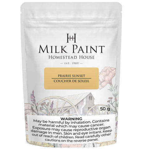 50g Homestead House Prairie Sunset Milk Paint bag with floral and barn art, plus health warning label.
