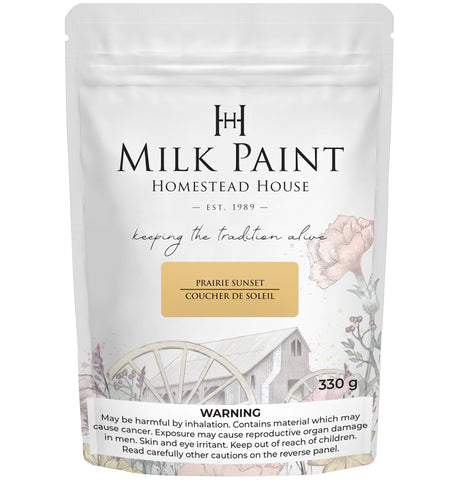 330g Prairie Sunset Milk Paint bag by Homestead House, featuring floral and wagon wheel illustrations.