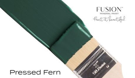 Paintbrush with Fusion Mineral Paint Pressed Fern color on bristles.