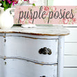 White pitcher with flowers on a distressed dresser painted Purple Posies by Old Fashioned Milk Paint.