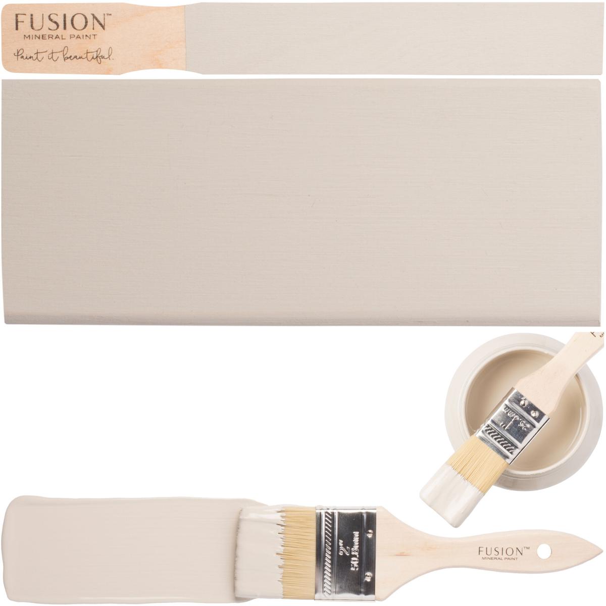 Putty Fusion Mineral Paint brush, painted board, and a brush resting in Fusion Mineral Paint can.
