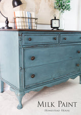 Vintage dresser painted Homestead House Quaker Blue Milk Paint with three drawers and metal knobs.