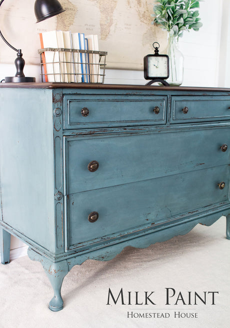 Vintage dresser painted Homestead House Quaker Blue Milk Paint with three drawers and metal knobs.