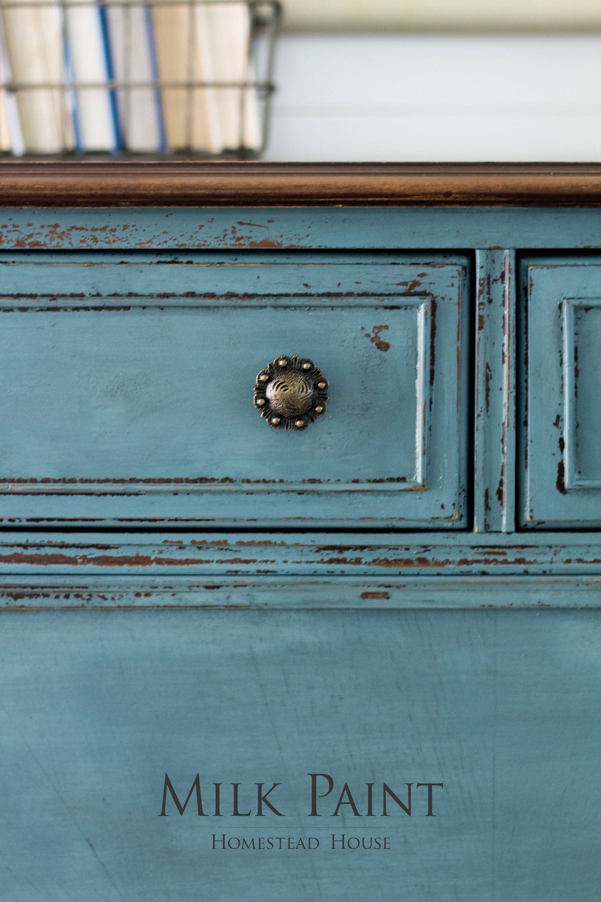 Distressed Quaker Blue Milk Paint drawer with round knob; text reads “Quaker Blue Milk Paint Homestead House.”.