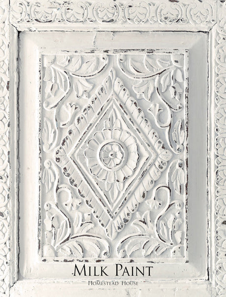 White ornate carved wood panel with floral motifs; Raw Silk Milk Paint by Homestead House text at bottom.