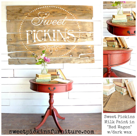 Red side table painted with Sweet Pickins Red Wagon Milk Paint, styled with books and a vase on top.