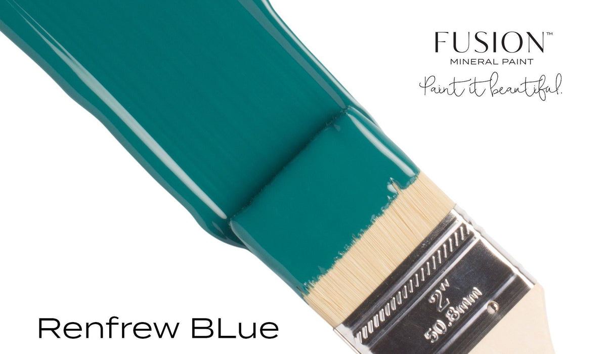 Brush with teal Renfrew Blue Fusion Mineral Paint, an all-in-one acrylic, on a white background.