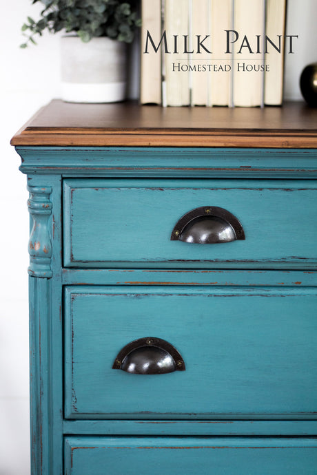 Renfrew Blue Milk Paint dresser by Homestead House with black handles; books and plant on top; text: Homestead House.