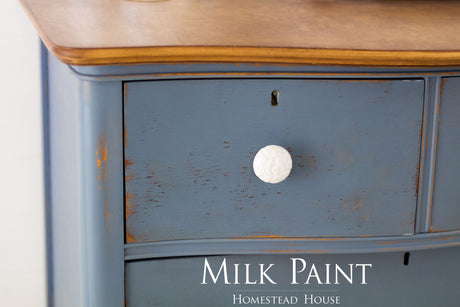 Blue dresser drawer with white knob, painted in Homestead House Rideau Blue Milk Paint.