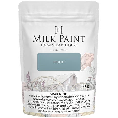 50g Homestead House Rideau Blue Milk Paint bag with floral design and warning label.