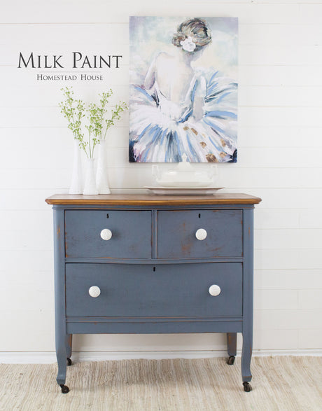 Vintage dresser in Homestead House Rideau Blue Milk Paint with white knobs.