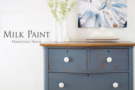 Blue wooden dresser in Homestead House Rideau Blue Milk Paint with white knobs.