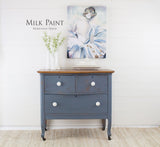Blue dresser in Rideau Blue Milk Paint by Homestead House with white knobs.