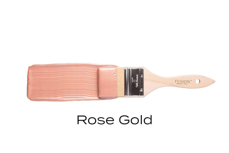 Paintbrush with Fusion Mineral Paint Rose Gold Metallic on bristles, “Rose Gold” text below.