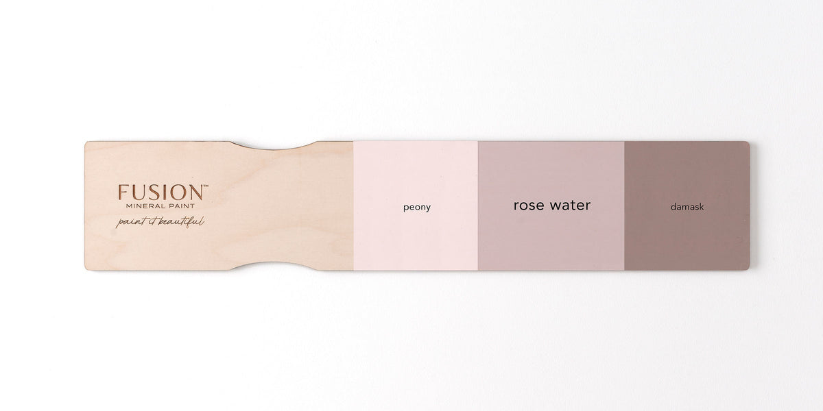 Paint swatch paddle showing Fusion Mineral Paint shades: Rose Water, peony, and damask.