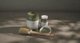 Three Rosemary Alchemy Fusion Mineral Paint jars, one open with a brush.