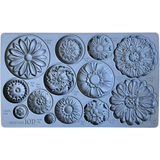 I.O.D. Rosettes Mould by Iron Orchid Designs with 12 distinct floral designs, each labeled with volume and weight.