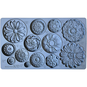 I.O.D. Rosettes Mould by Iron Orchid Designs with 12 distinct floral designs, each labeled with volume and weight.