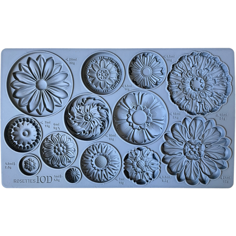 I.O.D. Rosettes Mould by Iron Orchid Designs with 12 distinct floral designs, each labeled with volume and weight.