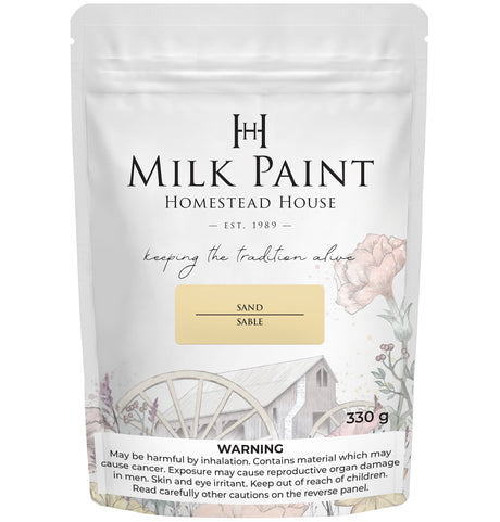 Homestead House Sand Milk Paint 330g bag with barn art and warning label on packaging.