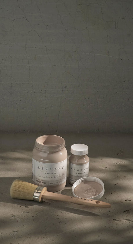 Two jars of Fusion Mineral Paint Sandstone Alchemy, one open with brush inside.