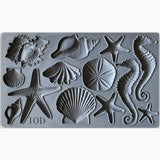 I.O.D. Sea Shells Mould with starfish, seahorses, sand dollars, and shells arranged in rows.