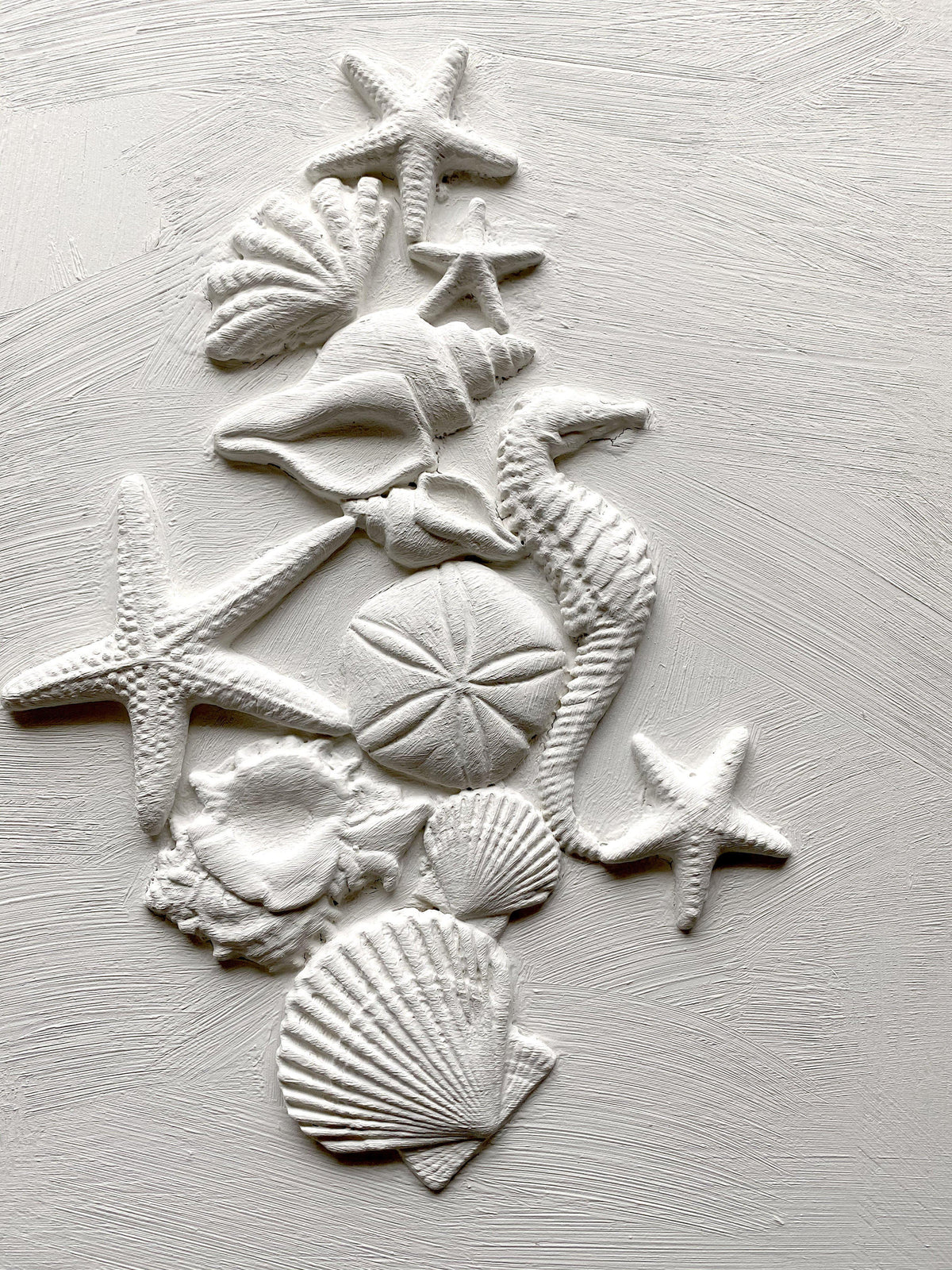 Sea Shells Mould by I.O.D. showing white seashells, a starfish, and sand dollar.