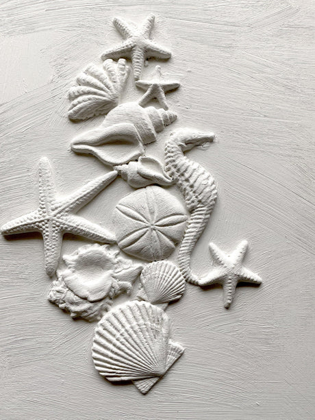 Sea Shells Mould by I.O.D. showing white seashells, a starfish, and sand dollar.