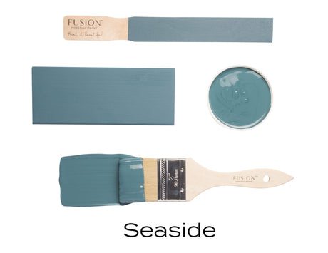 Fusion Mineral Paint Seaside blue sample cards and brush arranged together on a plain background.