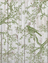 I.O.D. Shade & Song Stamp by Iron Orchid Designs showing green branch and bird on white wood with floral patterns.