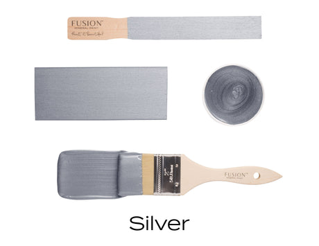 Paintbrush and swatches of Silver Metallic Fusion Mineral Paint by Fusion Mineral Paint on white background.