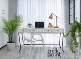 White desk painted Silver Screen by Fusion Mineral Paint, shown with laptop and lamp.