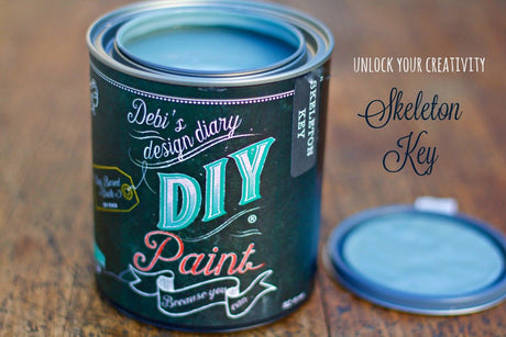 Open Skeleton Key DIY Paint by DIY Paint Co. on wood, with the lid placed next to the container.