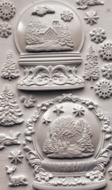 White ceramics featuring winter scenes made with IOD Snow Globes Mould, 2025 Limited Release.
