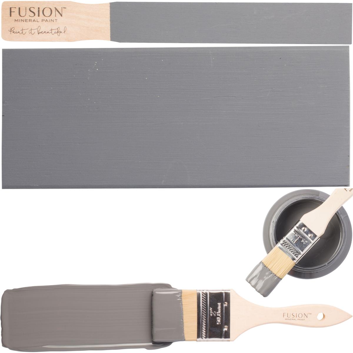 Soap Stone Fusion Mineral Paint with paintbrush, painted wood samples, and an open can displayed together.