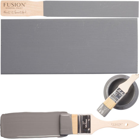 Soap Stone Fusion Mineral Paint with paintbrush, painted wood samples, and an open can displayed together.