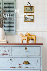 Dresser in Solstice Blue Milk Paint by Homestead House with gold handles.
