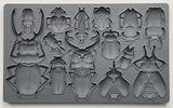 Specimens Mould by I.O.D., gray silicone tray with 17 beetle-shaped cavities labeled for weight and volume.