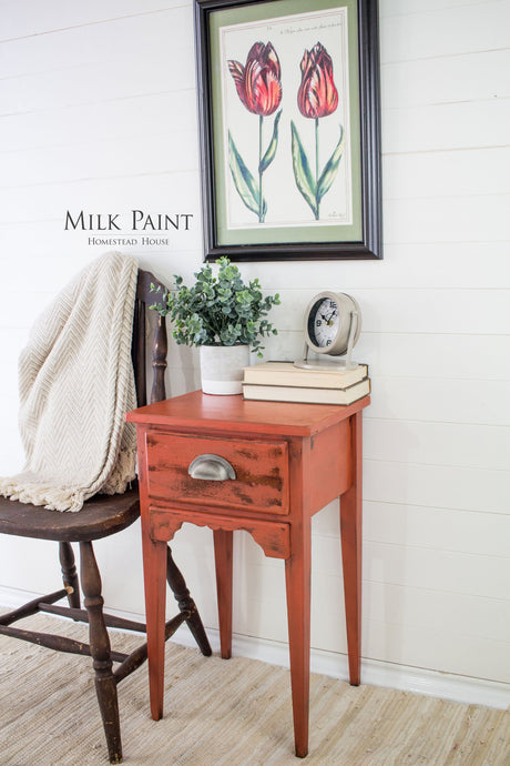 Small red nightstand painted with Homestead House Spice Milk Paint.
