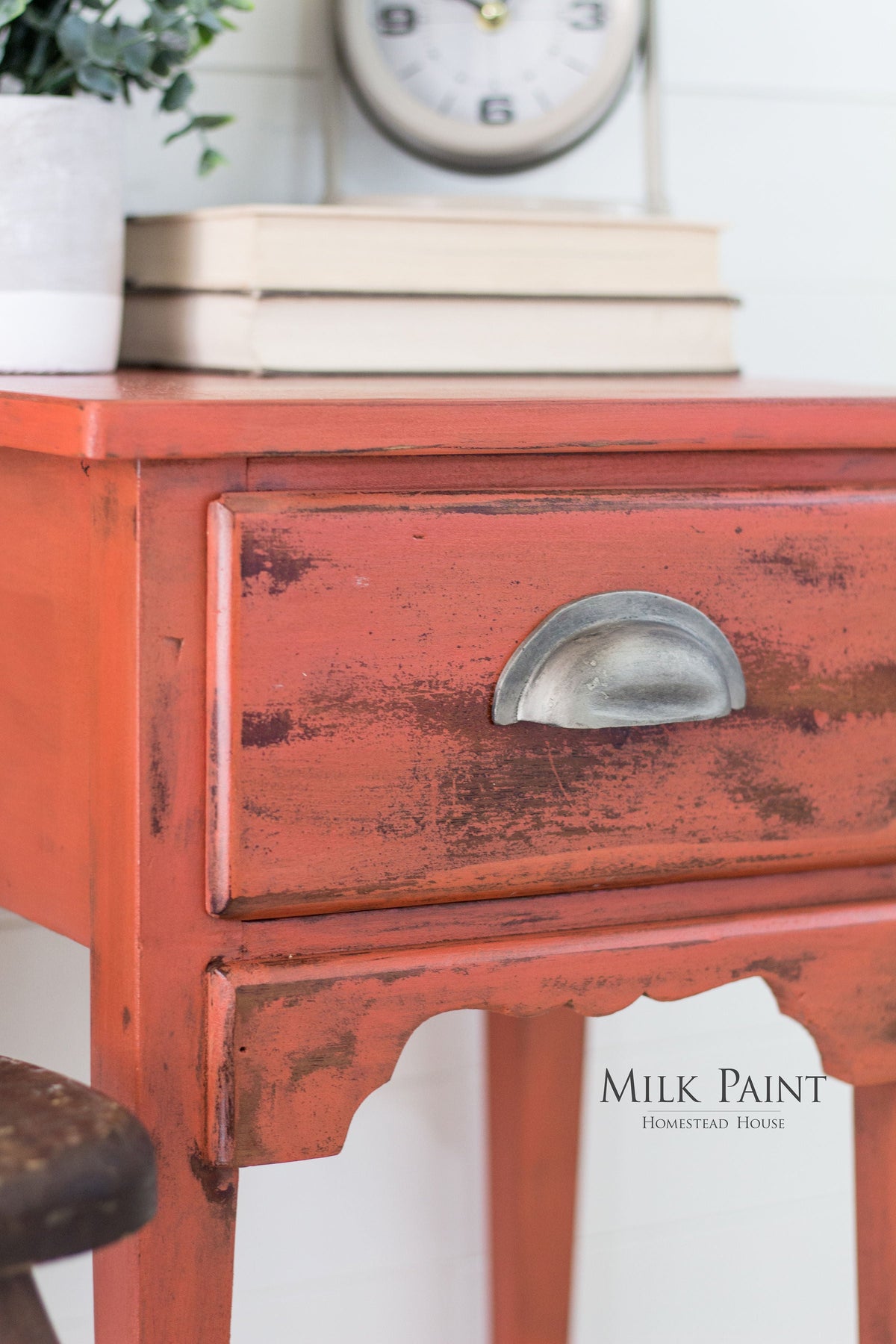 Distressed red side table finished with Homestead House Spice Milk Paint.