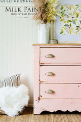 Pink vintage dresser in Spring Blossom Milk Paint by Homestead House, topped with a white vase.