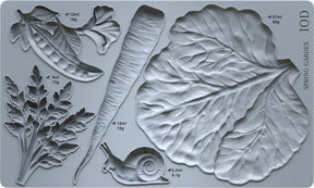 Spring Garden Mould by I.O.D. with pea pod, carrot, and cabbage leaf shapes plus printed measurements for crafting.