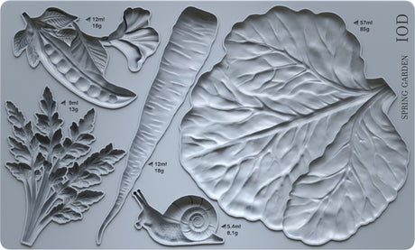 Spring Garden Mould by I.O.D. with pea pod, carrot, and cabbage leaf shapes plus printed measurements for crafting.