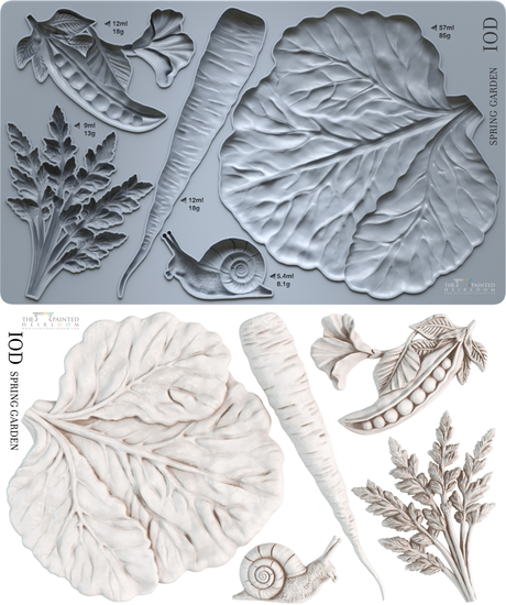Spring Garden Mould by I.O.D. featuring lettuce, carrot, pea pod, parsley, snail, and chard shapes on white background.