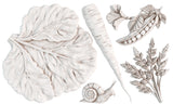 Large leaf, carrot, parsley, and snail in pale tones for I.O.D. Spring Garden Mould by Iron Orchid Designs.