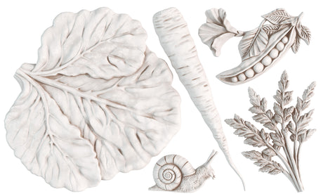 Large leaf, carrot, parsley, and snail in pale tones for I.O.D. Spring Garden Mould by Iron Orchid Designs.